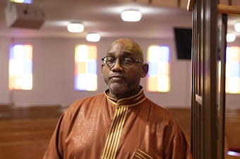 caption: Reverend Kenneth James Flowers, 62, Senior Pastor of Greater New Mt. Moriah Missionary Baptist Church, poses for a portrait after service on Sun., Feb. 25, 2024 in Detroit, Michigan.