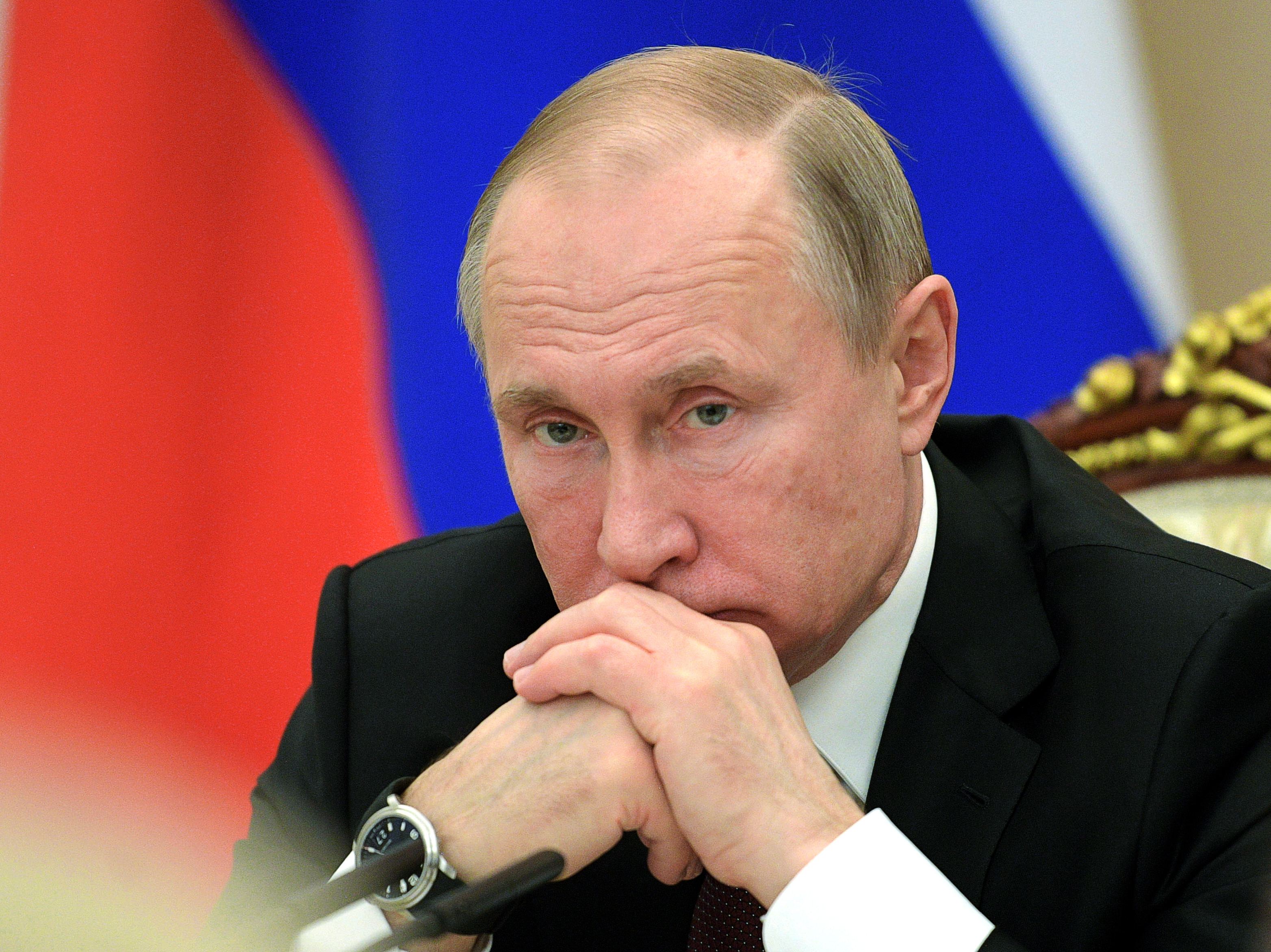 caption: Russian President Vladimir Putin chairs a cabinet meeting in the Kremlin in Moscow on Wednesday.