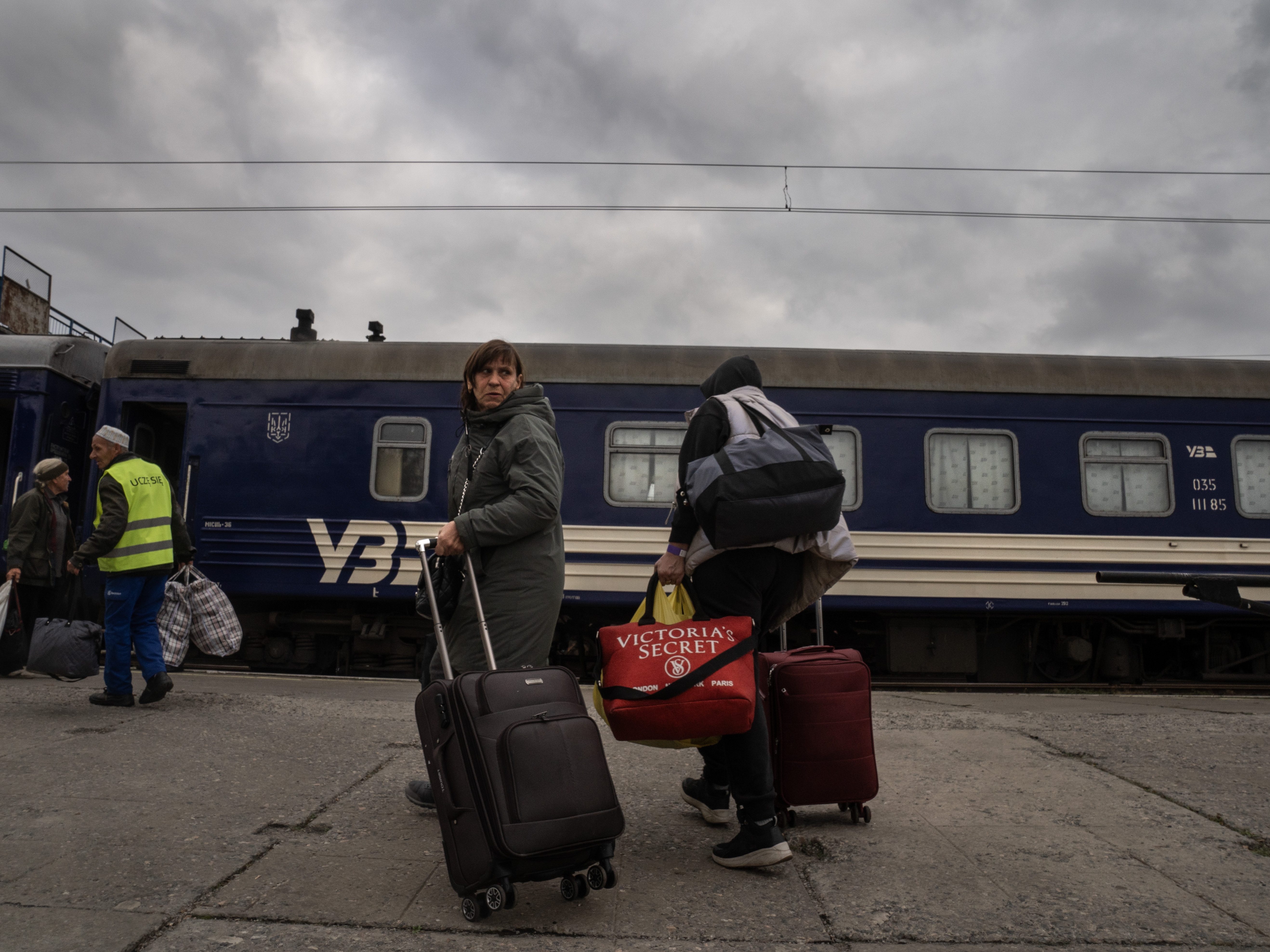 caption: Evacuees from the city of Pokrovsk arrive at the train station in Pavlohrad, Ukraine, on Oct. 15. They are fleeing to cities in western Ukraine or other points in Europe. Pokrovsk, a coal mining center in eastern Ukraine, is under frequent Russian artillery barrages and aerial attacks.