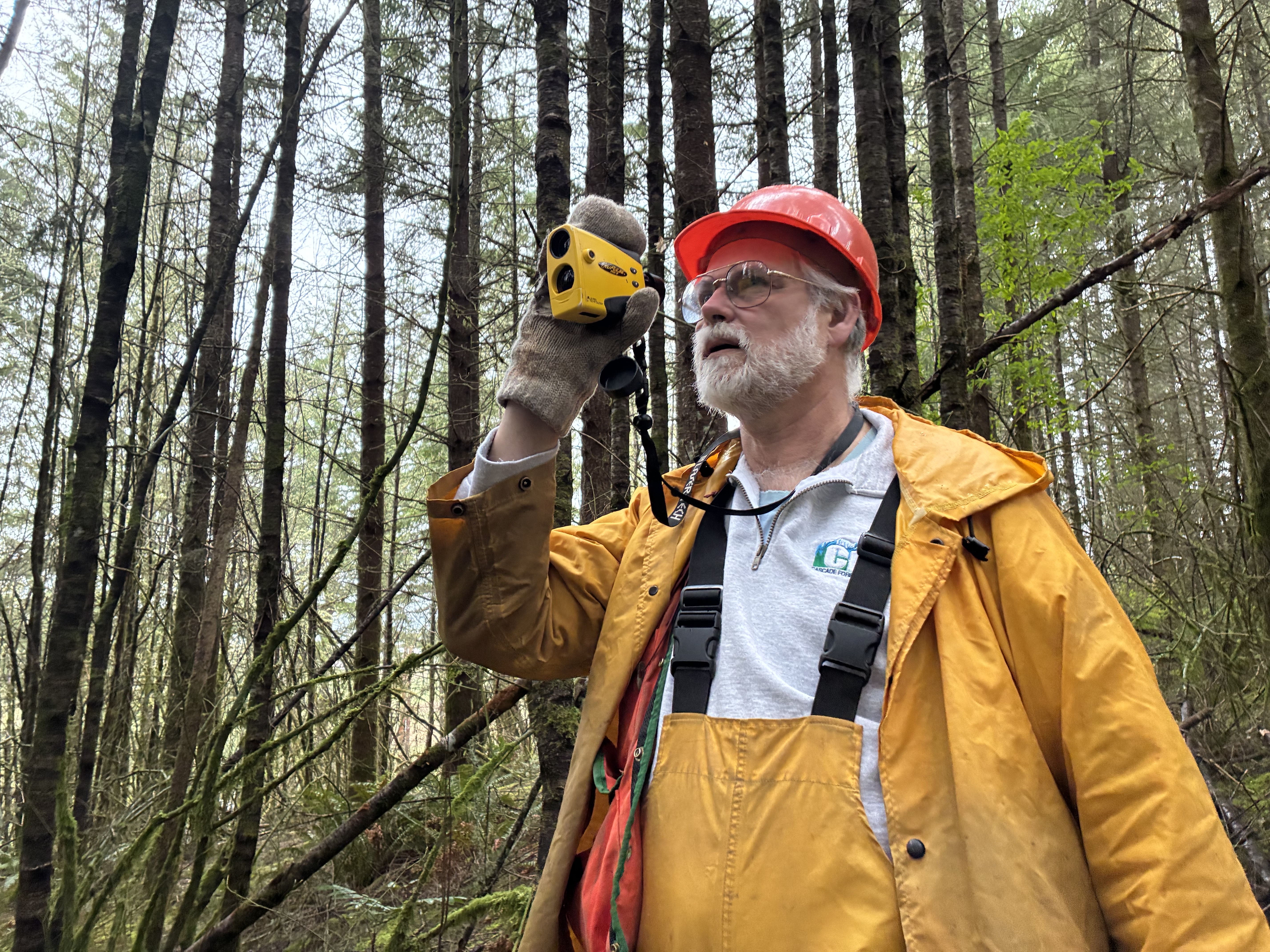 caption: Ed Orcutt (R-Kalama) is working his day job as a forester surveying Douglas fir trees in Centralia when Washington's Legislature isn't meeting.