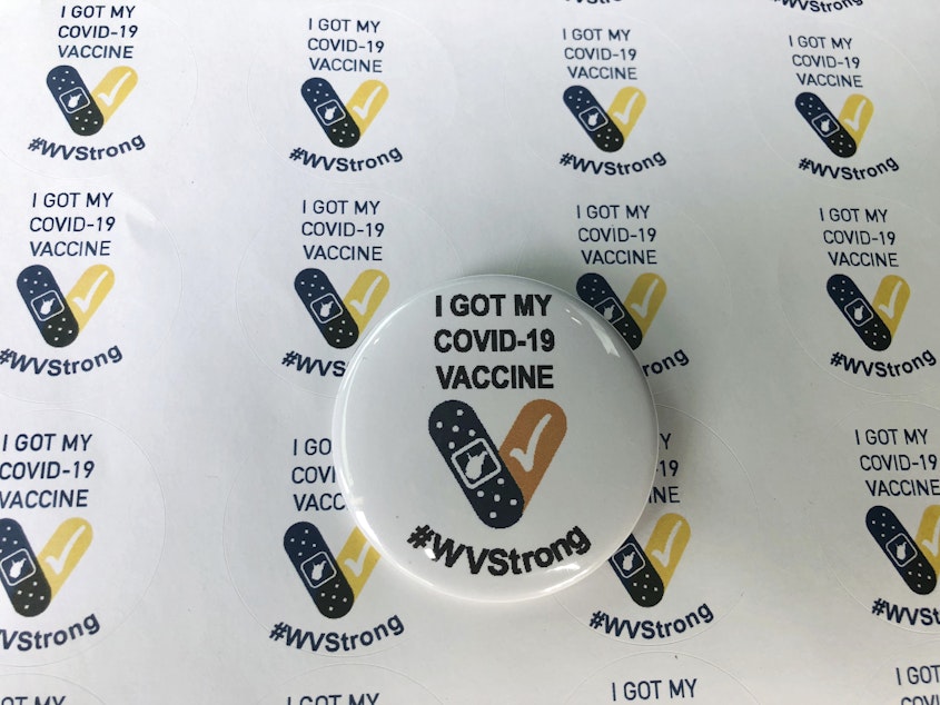 caption: West Virginians who get the COVID-19 vaccine could get more than stickers and buttons. On Tuesday, Gov. Jim Justice announced a lottery incentive program to encourage more residents to get vaccinated.