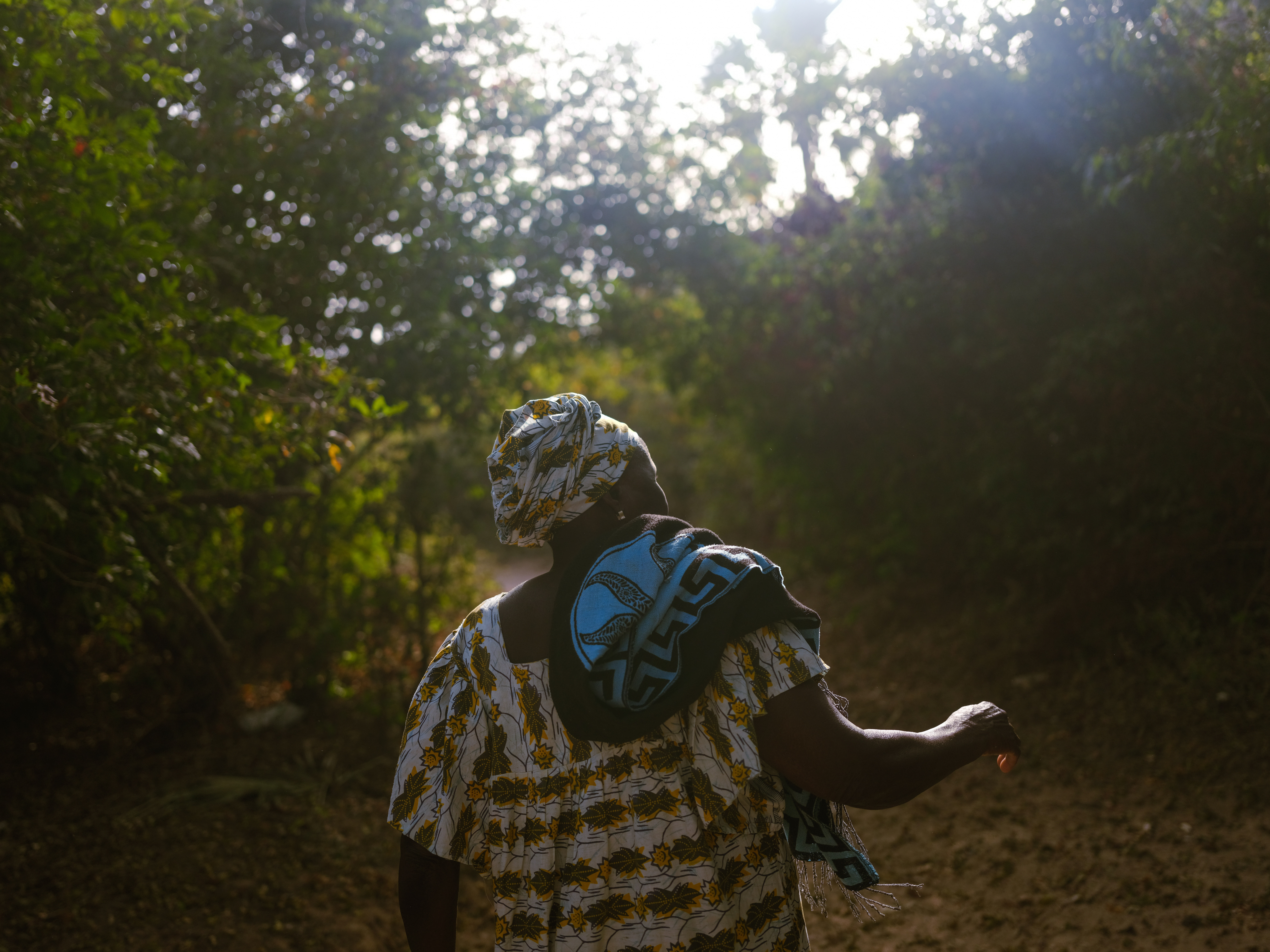 caption: Diakine Sambou, queen of the sacred forest of Kaoupoto, on Feb. 23, 2021, in Mlomp, Senegal.