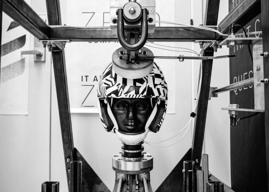 caption: The VICIS helmet is seen in a testing apparatus.