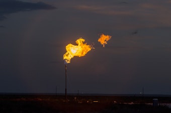 caption: A methane flare seen in Texas. Methane is an incredibly potent greenhouse gas that is currently released in huge quantities by oil and gas operations, landfills and agriculture.