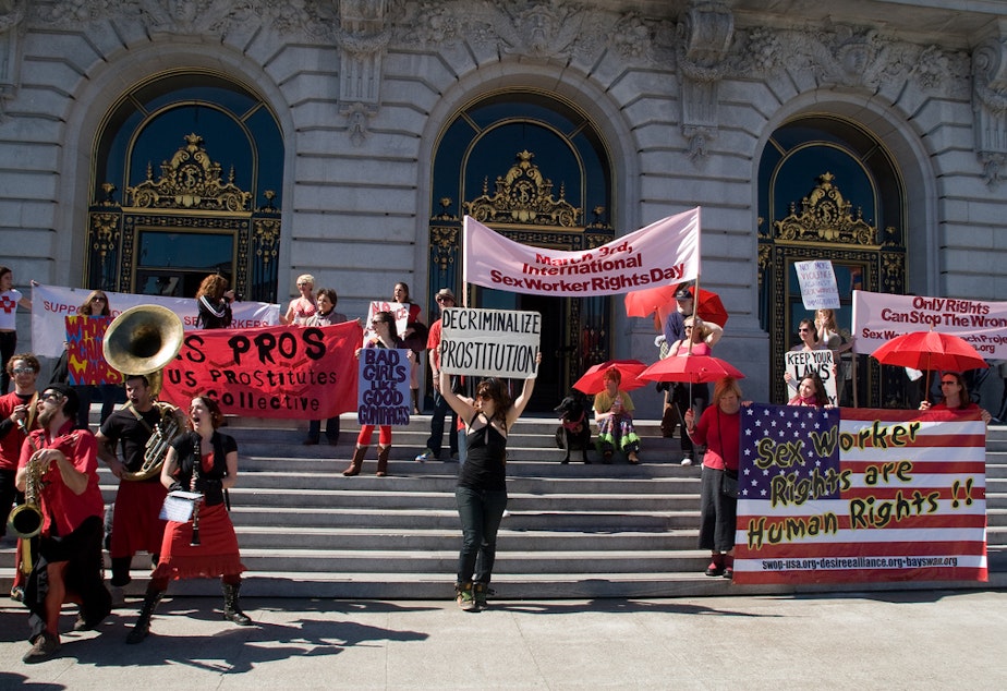 caption: March 3 is International Sex Workers' Rights Day. This protest took place in 2008 on the steps of San Francisco's city hall. The red umbrella symbolizes protection from violence.