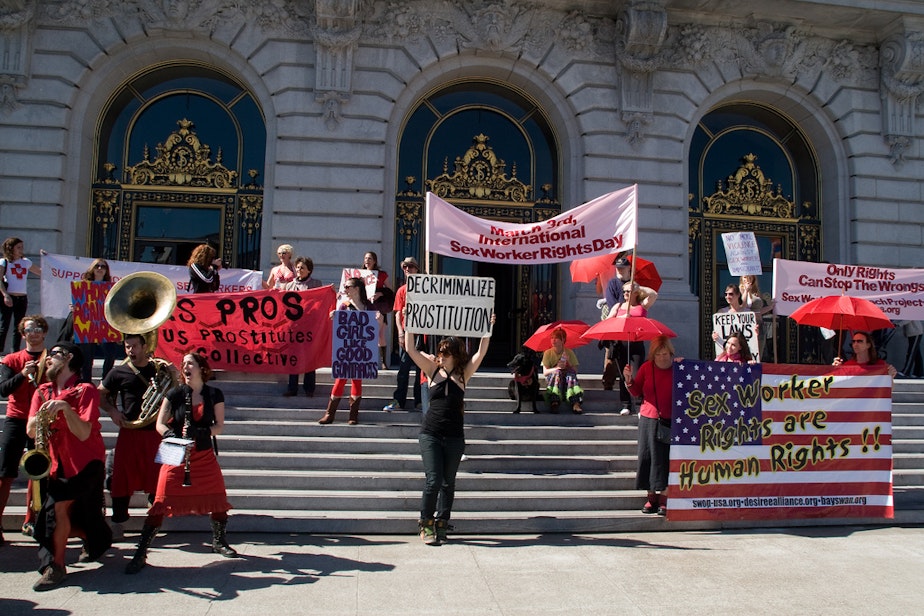 caption: March 3 is International Sex Workers' Rights Day. This protest took place in 2008 on the steps of San Francisco's city hall. The red umbrella symbolizes protection from violence.