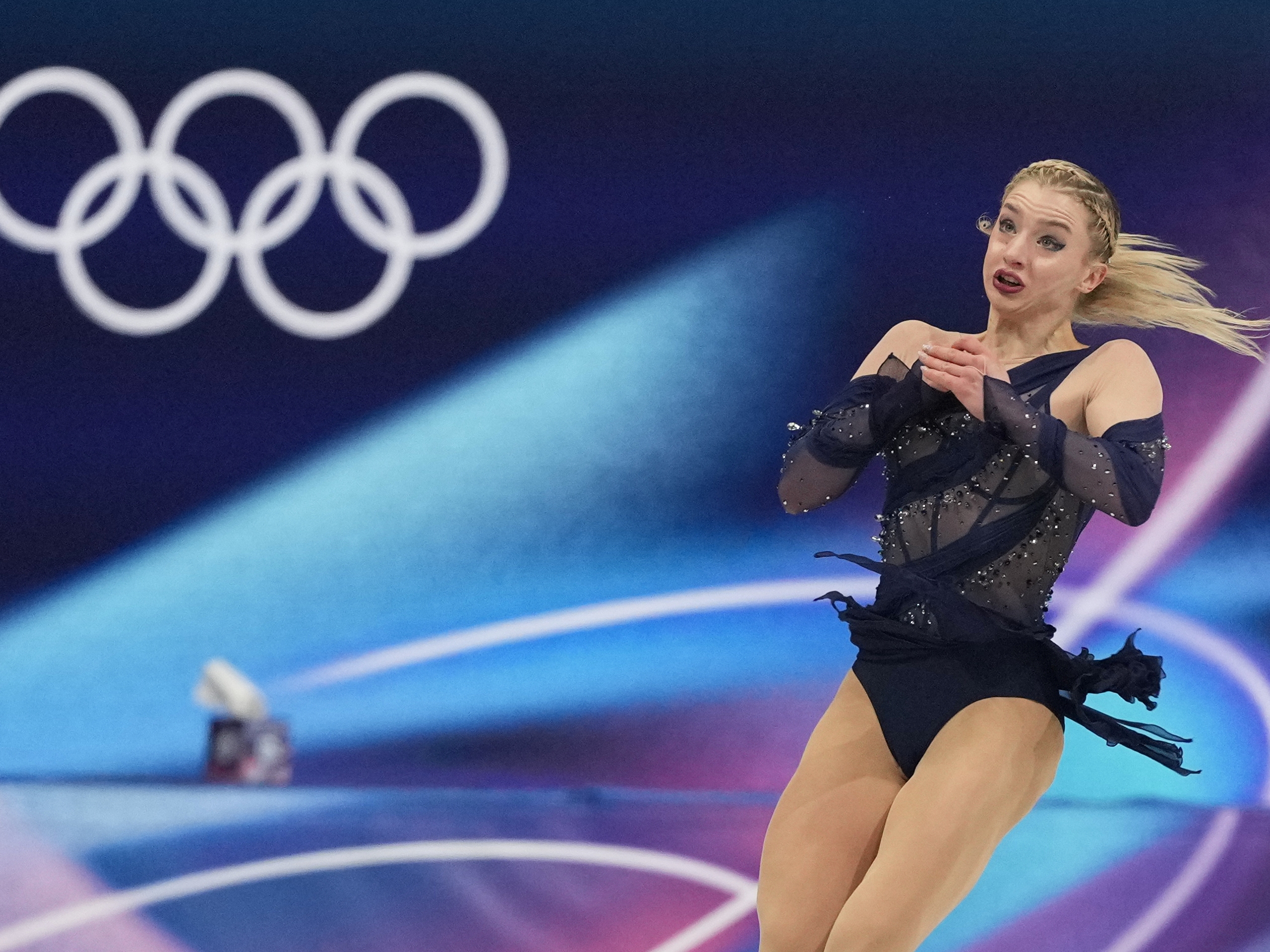 caption: Amber Glenn of the United States competes during the figure skating women's team event at the 2026 Winter Olympics, in Milan, Italy, Sunday, Feb. 8, 2026. Glenn says she's received online hate and threats for speaking out in support of LGBTQ rights in Milan.
