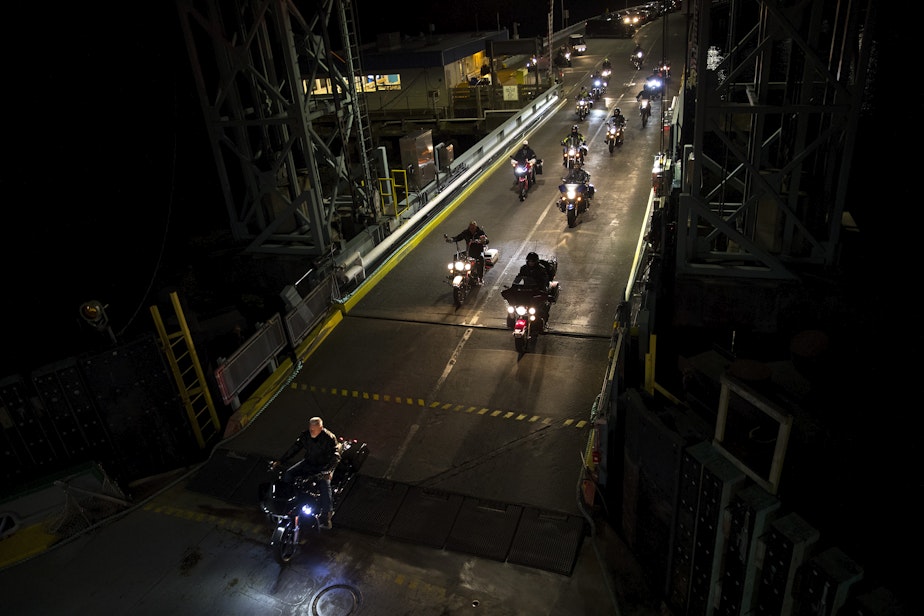 caption: Motorcyclists drive onto a ferry in Southworth at 4:00 a.m. on Wednesday, June 12, 2019, heading to the Fauntleroy Terminal in West Seattle. 