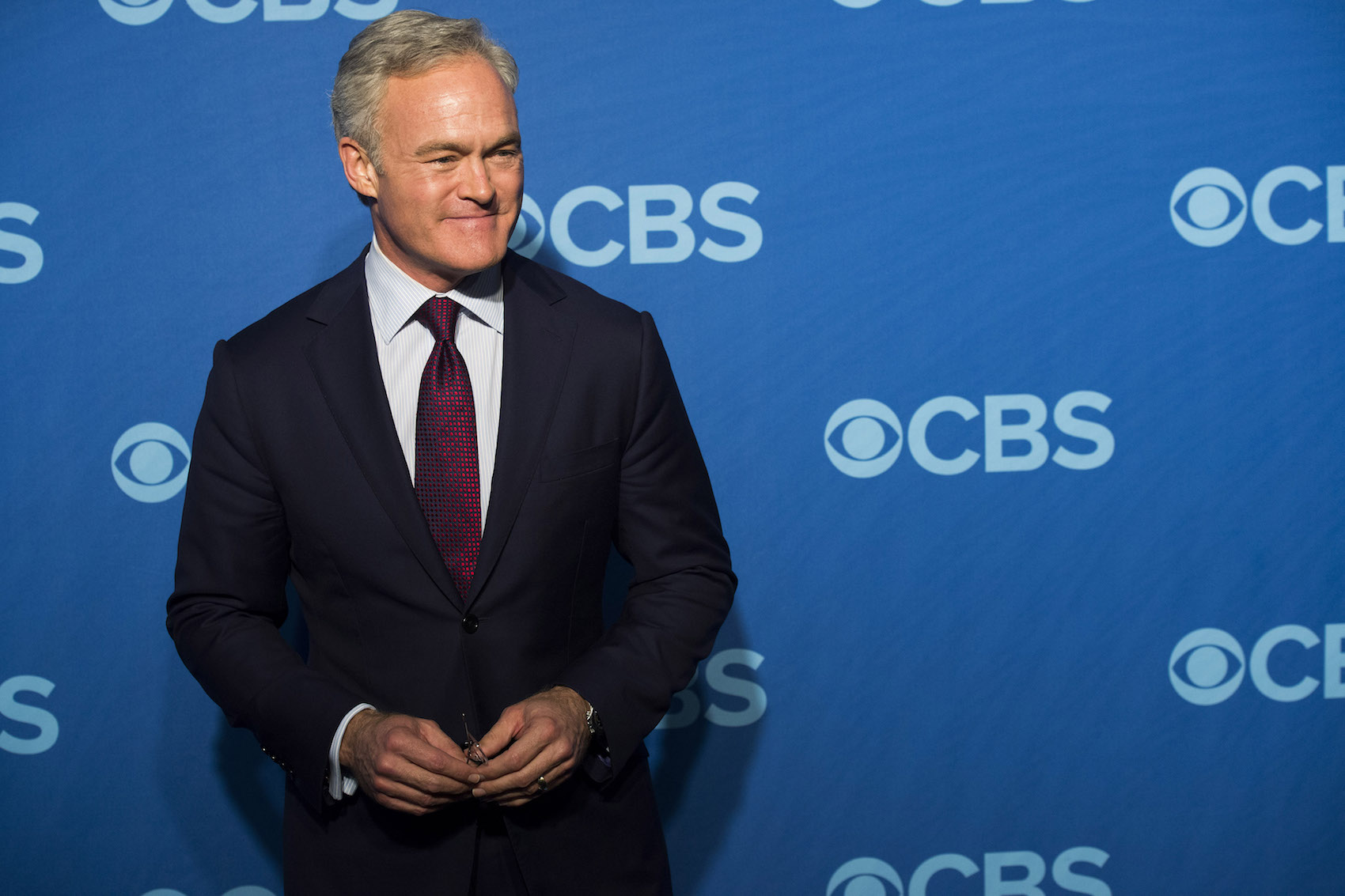 caption: This May 15, 2013 file photo shows Scott Pelley at the CBS Upfront in New York. (Charles Sykes/Invision/AP, File)