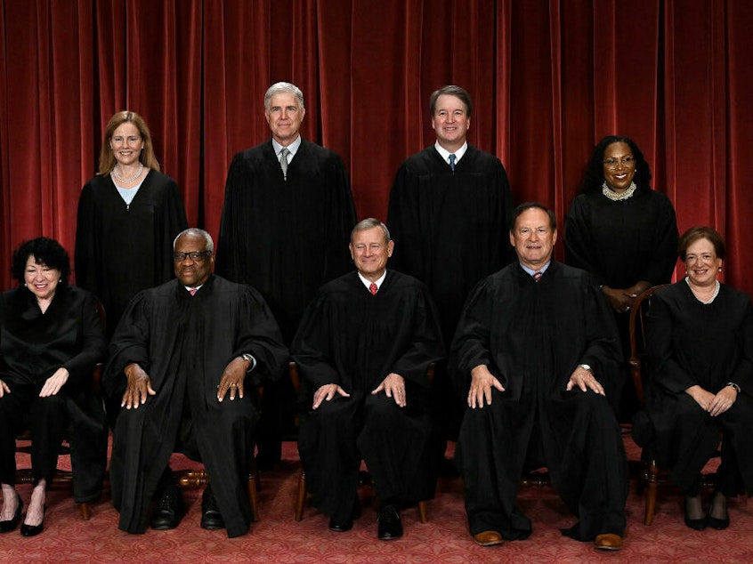 caption: The justices of the U.S. Supreme Court appeared likely to uphold a law that bans gun possession for anyone covered by a domestic violence court order.