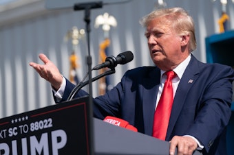 caption: Former President Donald Trump speaks to a crowd during a campaign rally on Sept. 25, 2023 in Summerville, S.C.