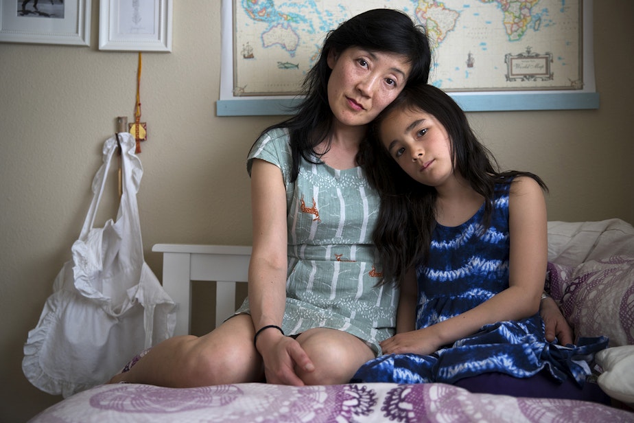 caption: Katherine Lee with her 8-year-old daughter Ellie Stearns in Seattle. “She was hungry a lot. She had a hunger cry, which is different from discomfort cry or ‘I’m tired’ cry. That triggered panic in my brain. It was always frantic. I started supplementing with formula. That was crushing. I know there are some parents, ‘Oh yeah, we supplement.’ Looking back, I can see how some people can say it’s not such a huge deal, don’t worry about it, but say that to a mom who is in a constant state of panic."