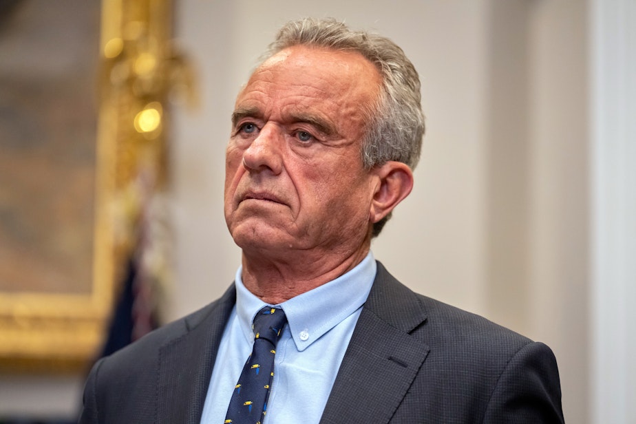 caption: Health and Human Services Secretary Robert F. Kennedy Jr. listens during an event with President Donald Trump in the Roosevelt Room at the White House, Monday, May 12, 2025, in Washington.
