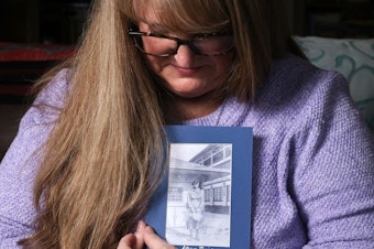 caption: Carrie Davidson holds a photo of her great-grandmother, a Northern State Hospital patient named Lillian