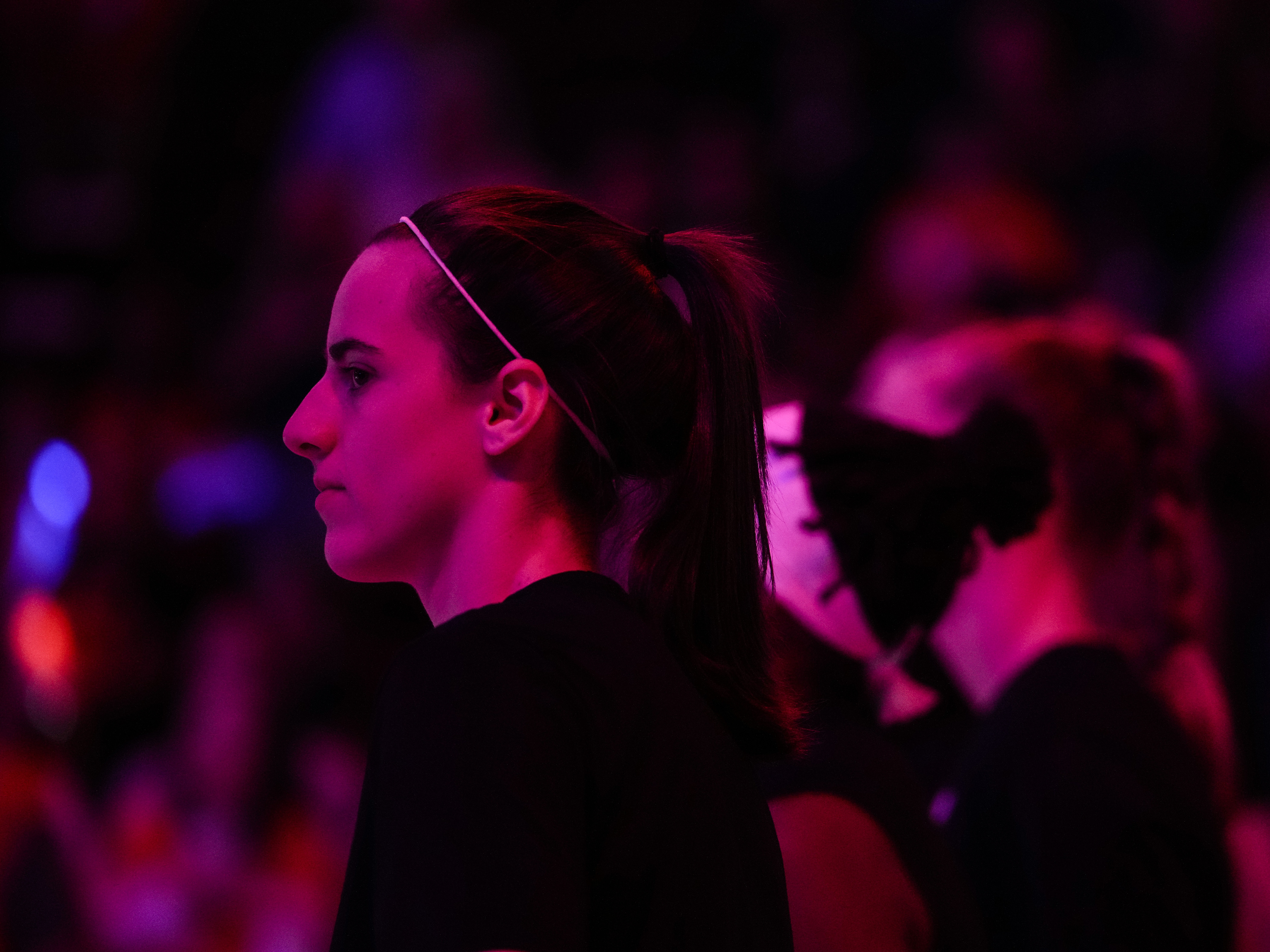 caption: Caitlin Clark at a WNBA playoff game in September.
