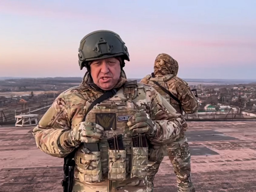 caption: In this handout photo taken from video released by Prigozhin Press Service on Friday, March 3, 2023, Yevgeny Prigozhin, the owner of the Wagner Group military company, addresses Ukrainian President Volodymyr Zelenskyy asking him to withdraw the remaining Ukrainian forces from Bakhmut to save their lives, at an unspecified location in Ukraine.