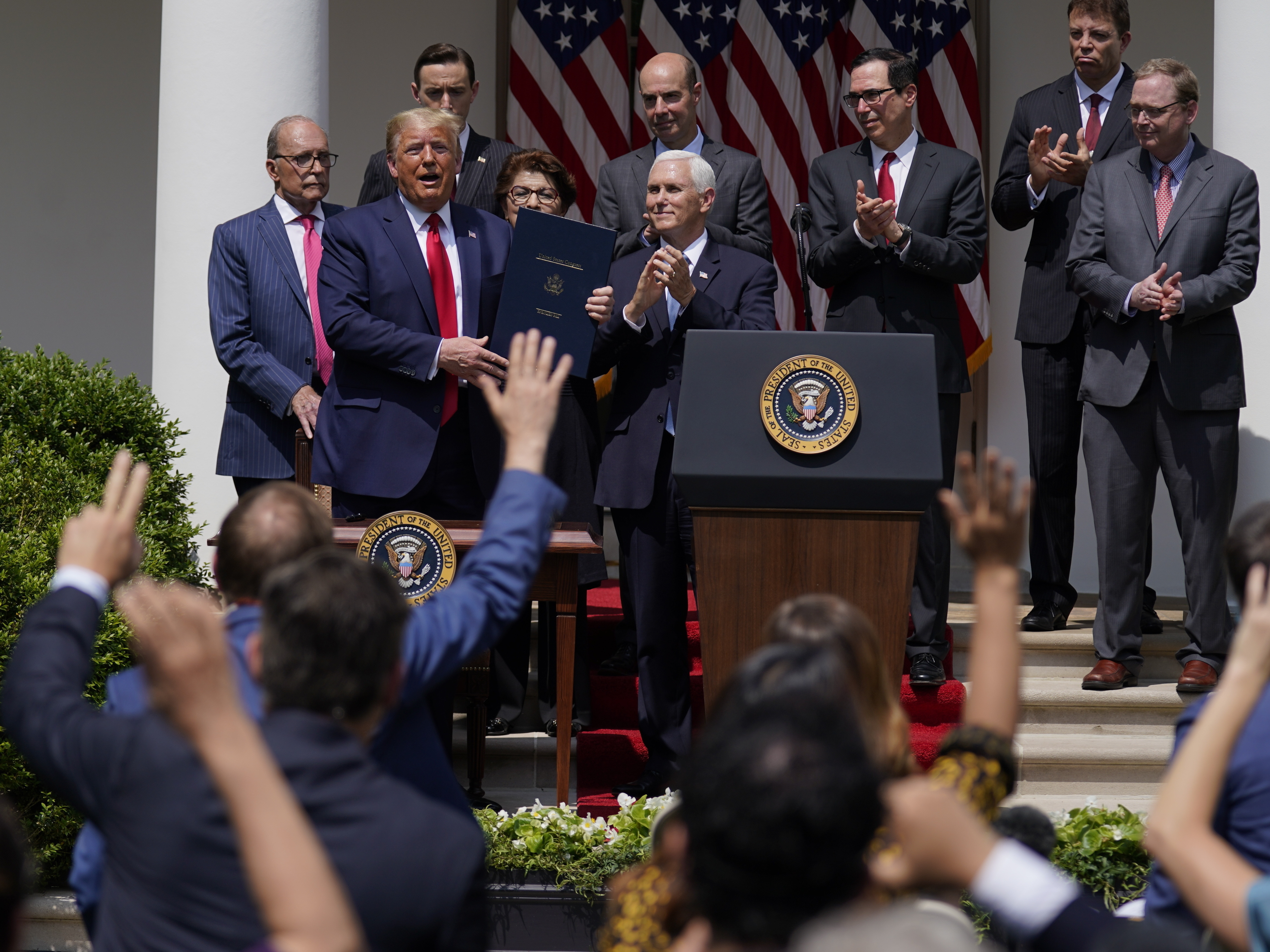 caption: President Trump, pictured June 5, signs a bill extending the time period for businesses to use funds from the Paycheck Protection Program. On Saturday he signed a bill extending the deadline to apply for the program.