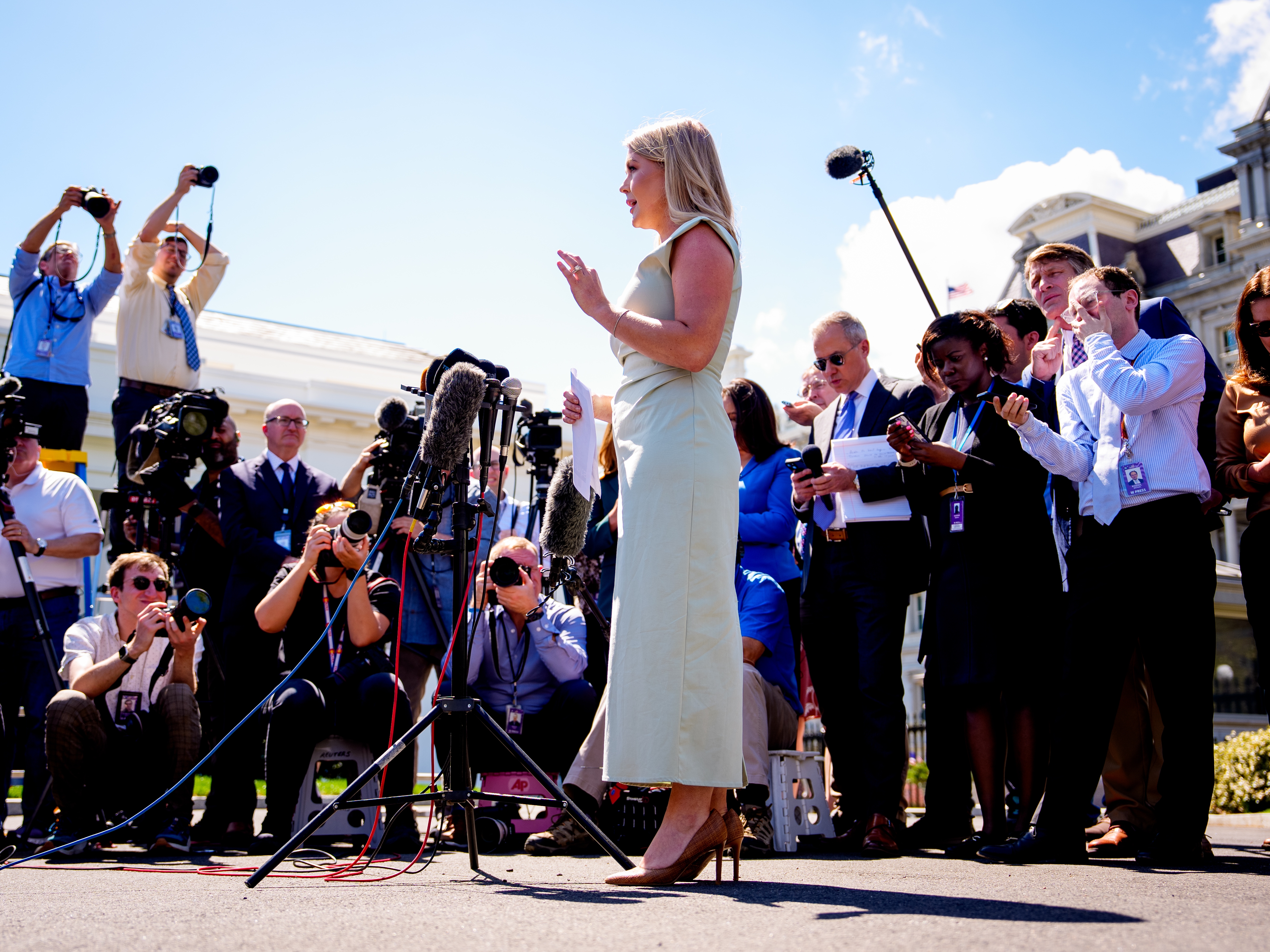 caption: White House press secretary Karoline Leavitt speaks to reporters on the White House driveway on March 31, 2025.
