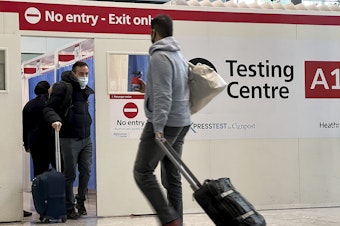Passengers get a COVID test at Heathrow Airport in London in November 2021. On June 12, the Centers for Disease Control and Prevention lifted its requirement for pre-departure testing for travelers flying into the U.S.