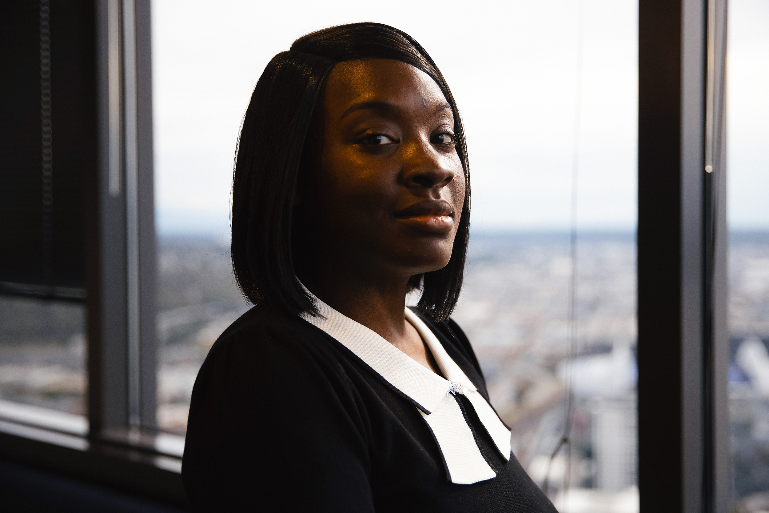 caption: Ashley Miller is portrayed on Tuesday, September 30, 2025, at the PCVA law office in downtown Seattle. 