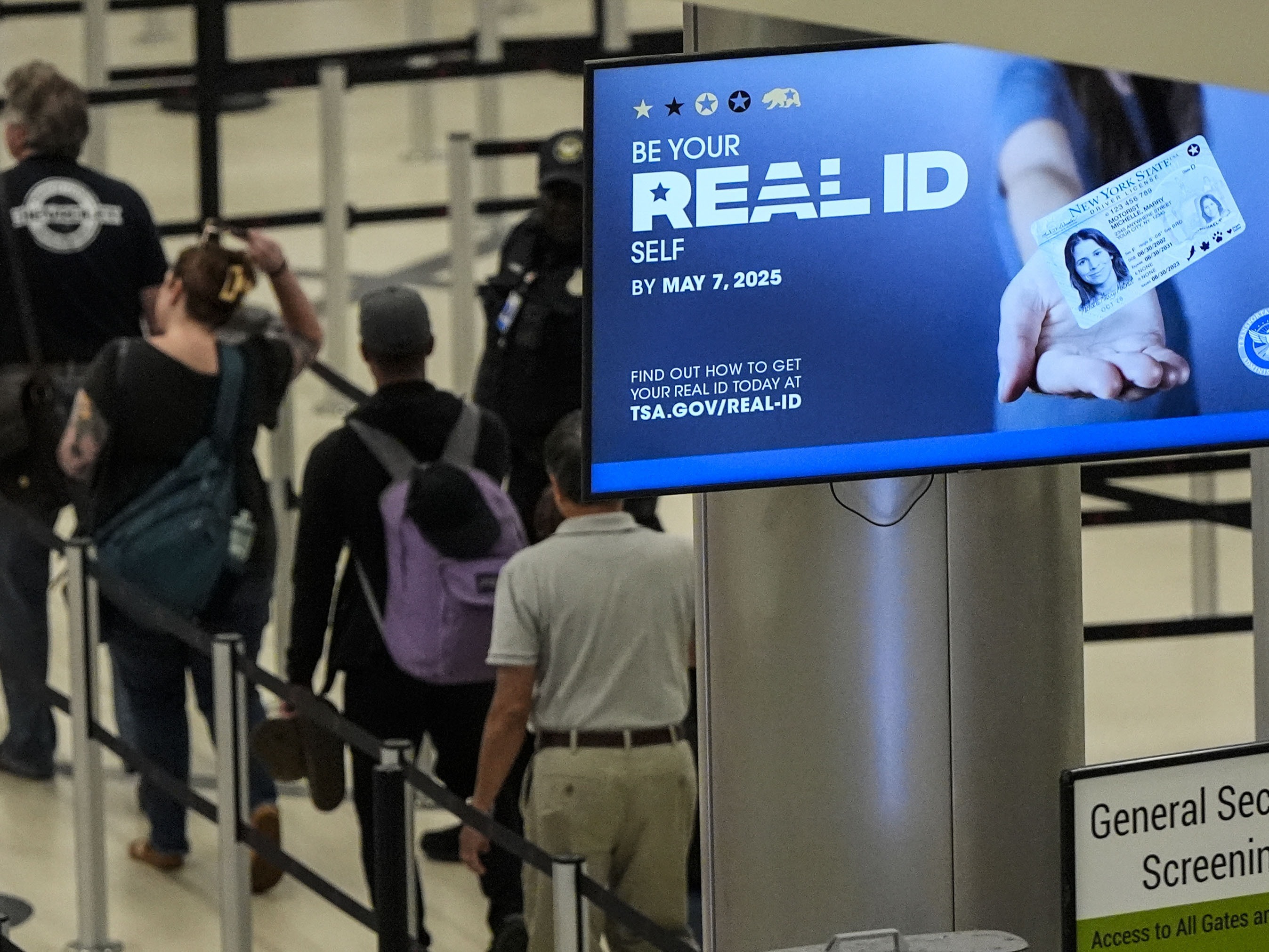 caption: Travelers move through Hartsfield-Jackson Atlanta International Airport ahead of Memorial Day last year.
