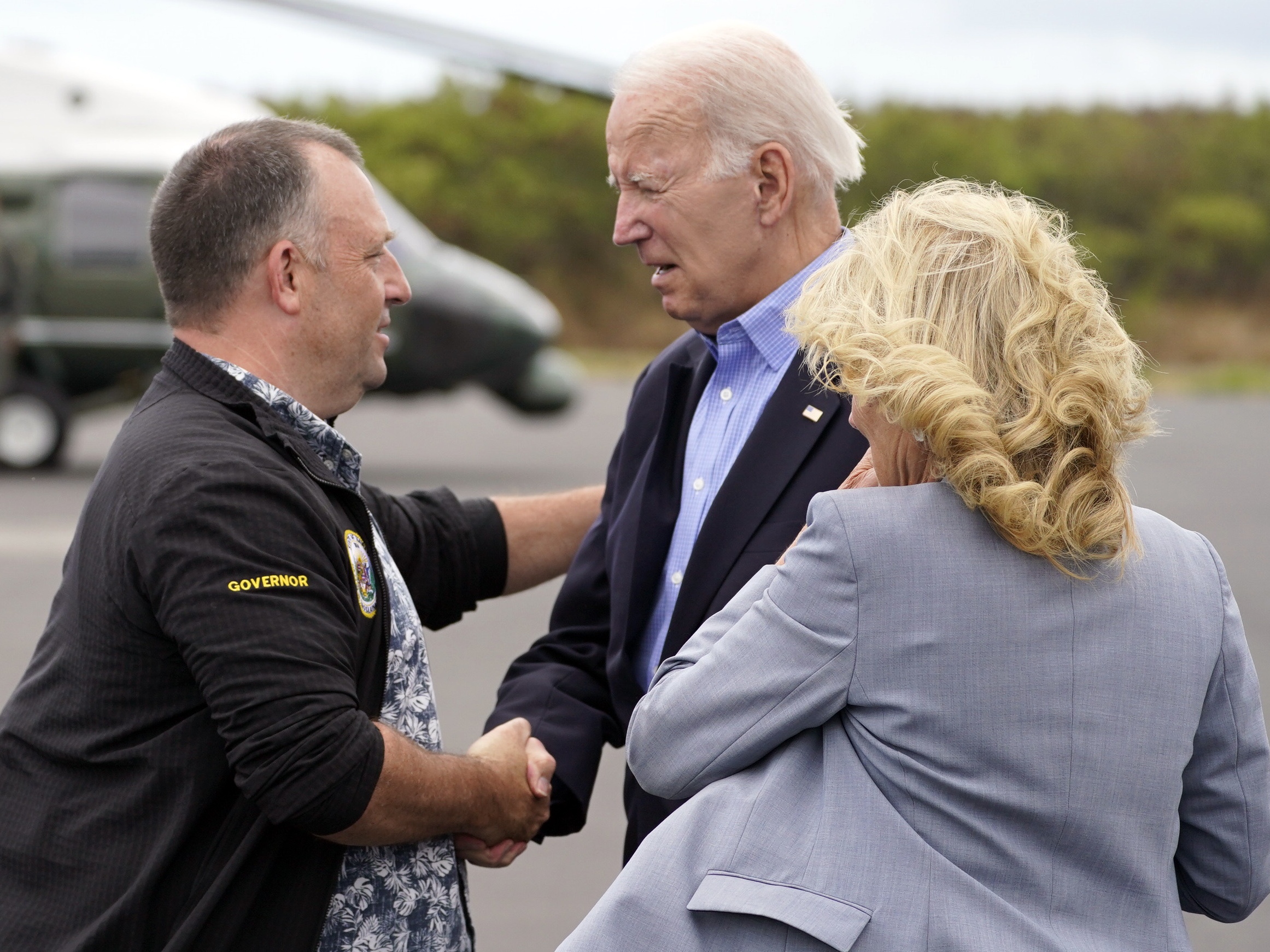 caption: President Joe Biden and first lady Jill Biden met Hawaii Gov. Josh Green in August 2023 after devastating wildfires struck Maui. Green was one of the Democratic governors who sat down with Biden to talk about the presidential campaign.