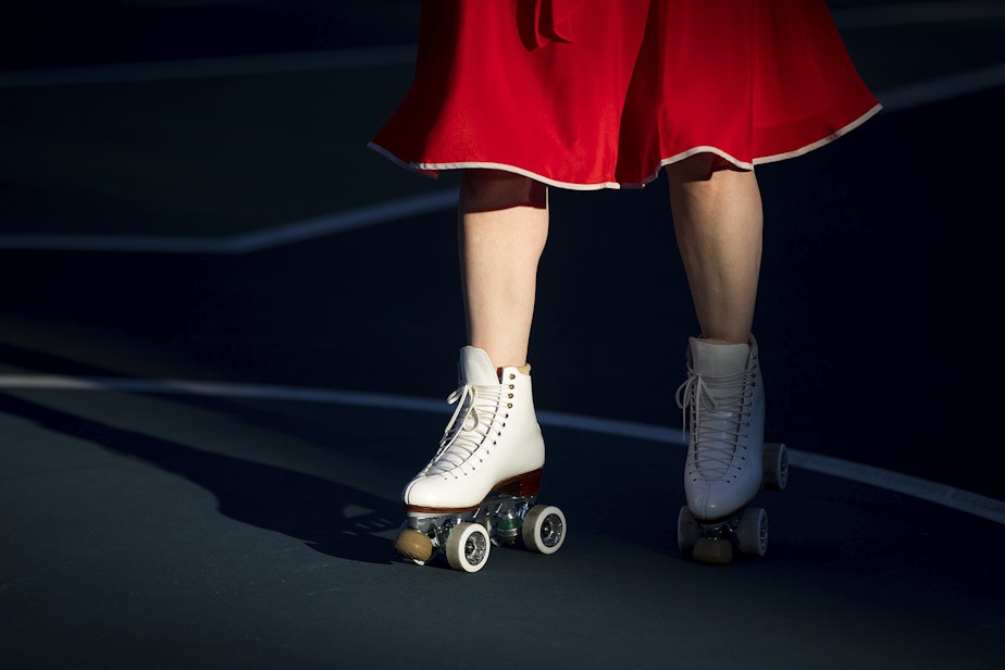 caption: Melinda Davis skates during a decades themed skate meet up on Tuesday, October 6, 2020, at the White Center Bicycle Playground in Seattle. 