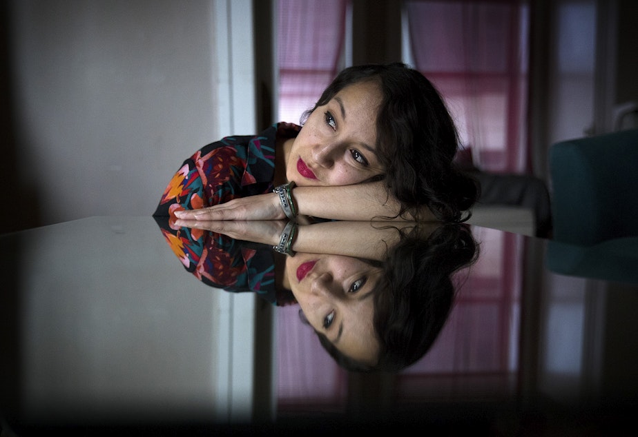 Photographer Marilyn Montufar poses for a portrait on Wednesday, Feb. 14, 2018, in Seattle.