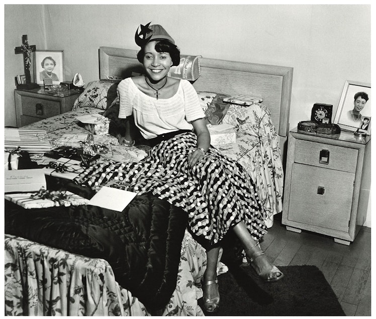 caption: An unidentified hostess from a house party in Seattle's Central District, around 1950. Photographer Al Smith took tens of thousands of photos, many in Seattle's Central District, the heart of the city's African-American community. (To help us ID individuals, note the photo number. This is #1.)