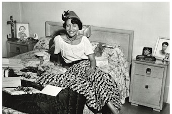 caption: An unidentified hostess from a house party in Seattle's Central District, around 1950. Photographer Al Smith took tens of thousands of photos, many in Seattle's Central District, the heart of the city's African-American community. (To help us ID individuals, note the photo number. This is #1.)