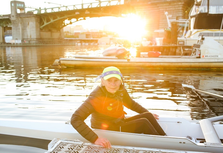 caption: Coxswain Alex O'Reilly prepares to go out on a morning row with her master's crew team at Pocock Rowing Club, September 16, 2021.