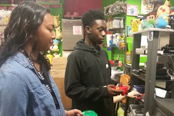 caption: Annika Prom and Tre'vion Sinclair enjoying Nintendo 64 even though they’re very serious. (It's more than a game. It's a lifestyle.)
