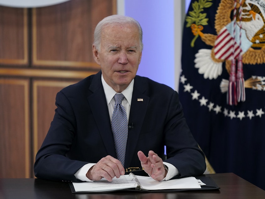 caption: President Joe Biden speaks at the fourth virtual Major Economies Forum on energy and climate on Thursday in the South Court Auditorium on the White House campus in Washington.