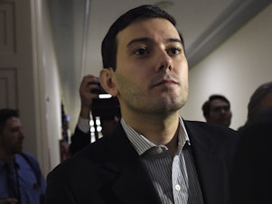 caption: Martin Shkreli leaves after appearance on Capitol Hill in Washington before the House Committee on Oversight and Reform Committee, Feb. 4, 2016.