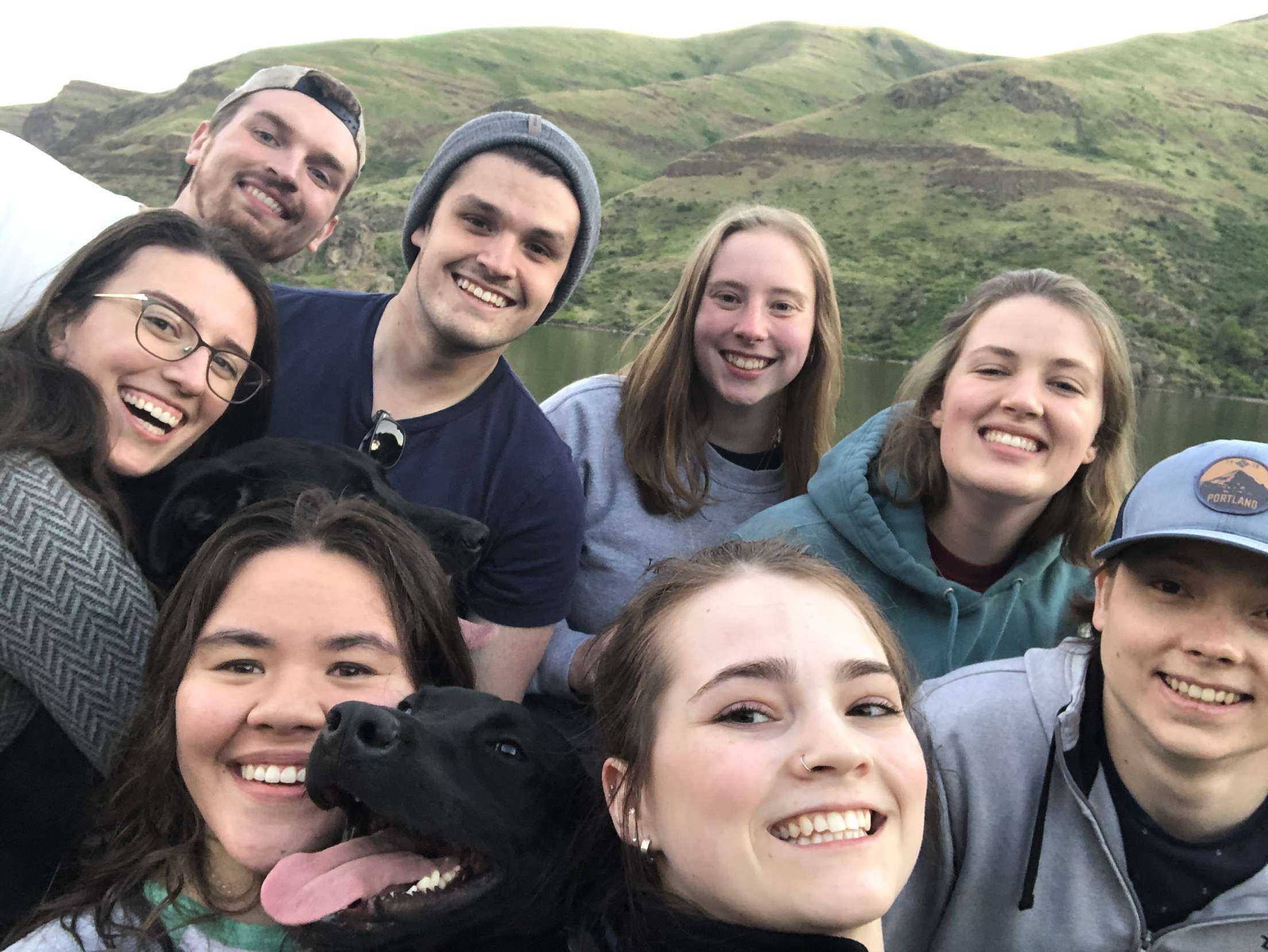 caption: {From bottom left] Natalie Newcomb celebrates graduating with her dog, Pulitzer, and friends Katie Collins, Taner Schiller, [from top left] Tessa Czech, Ruby the dog, Lucas Mason, Colby Enebrad, Katie Arrasmith, and Paige Campbell. 