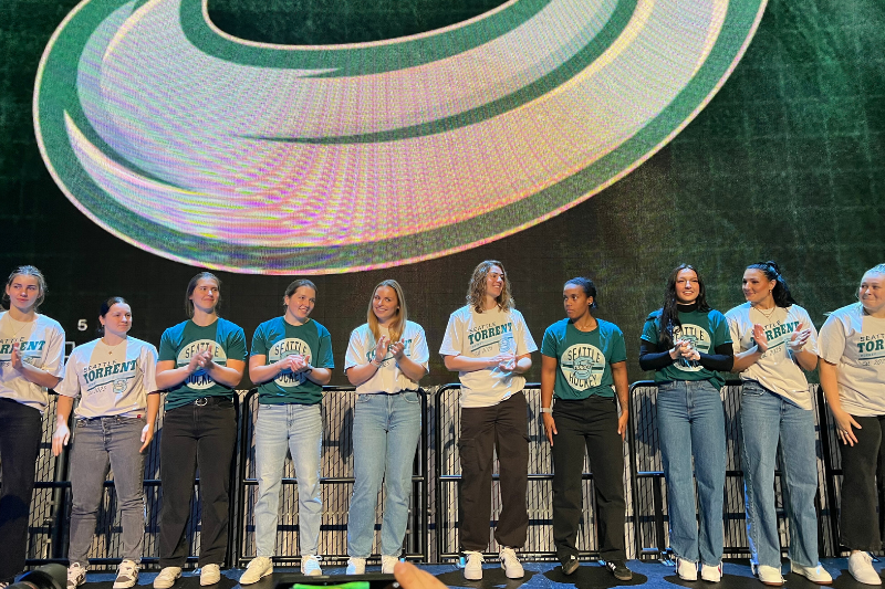 caption: The Professional Women's Hockey League announced the name of Seattle's new team, the Seattle Torrent, at MoPop on Thursday, Nov. 6, 2025. The name thematically plays well with Seattle's other professional women's teams, the Storm and the Reign. 