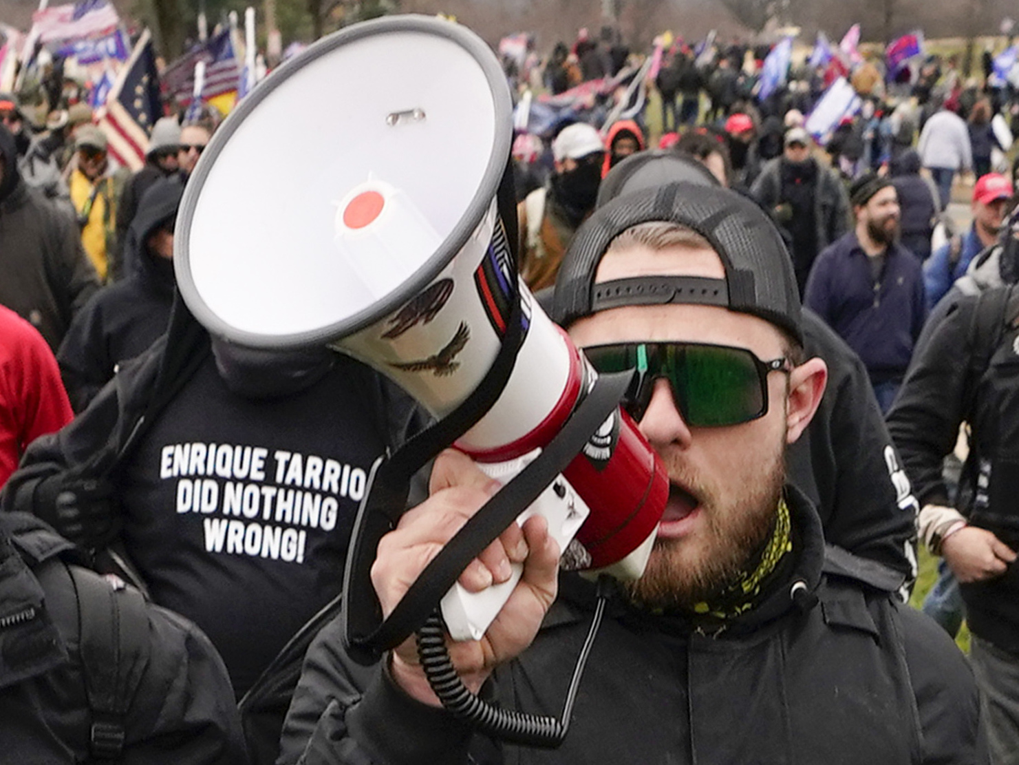 caption: Proud Boys walk toward the U.S. Capitol in Washington in support of President Donald Trump on Jan. 6, 2021. A federal judge has refused to dismiss an indictment charging four alleged leaders of the group with conspiring to attack the Capitol.