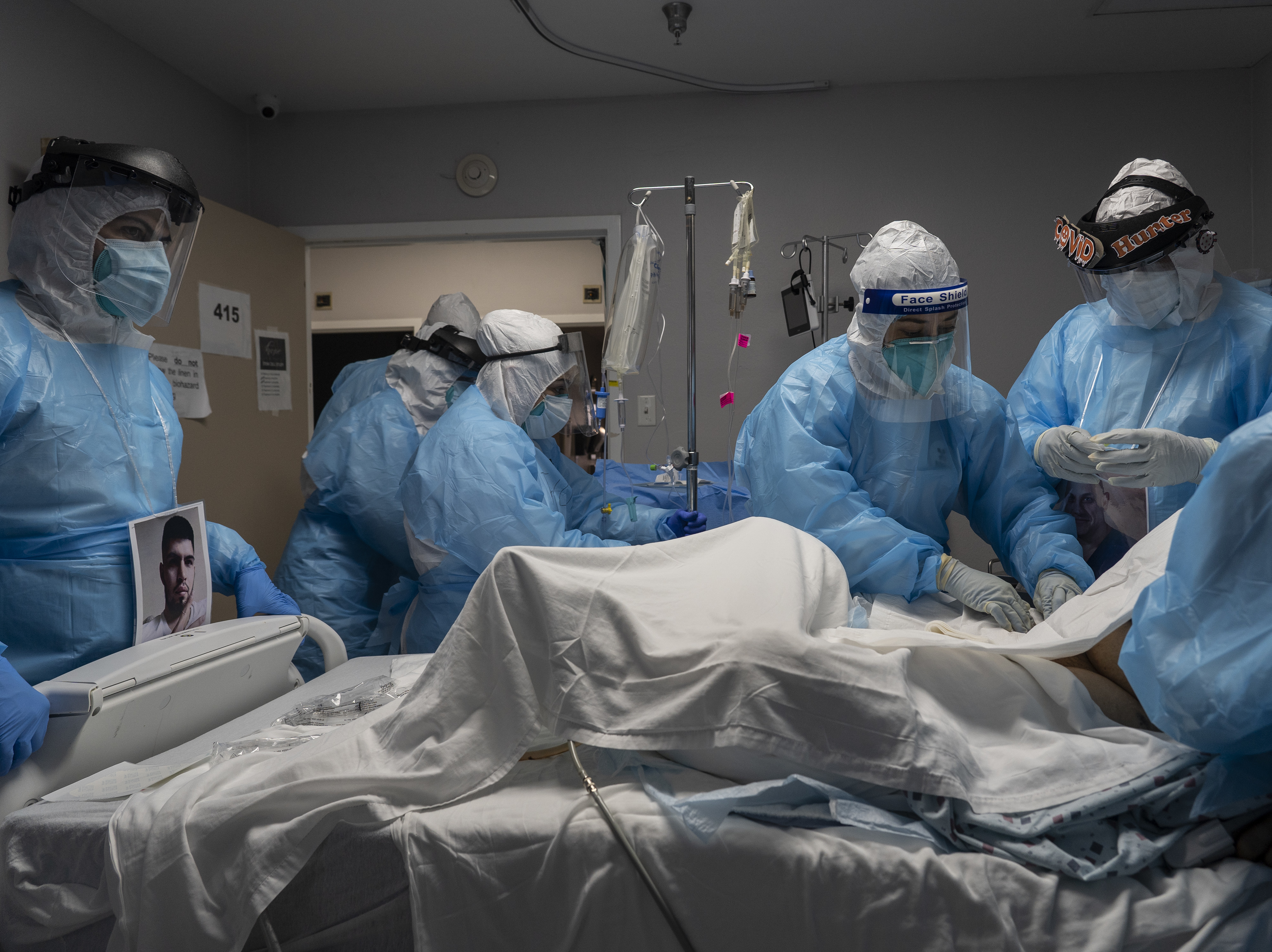 caption: Medical staff members treat a patient seriously ill with COVID-19 in the intensive care unit of United Memorial Medical Center on Oct. 31 in Houston. Experts say immunizing health workers first, once a COVID-19 vaccine's available, is best to curb deaths and stop transmission.