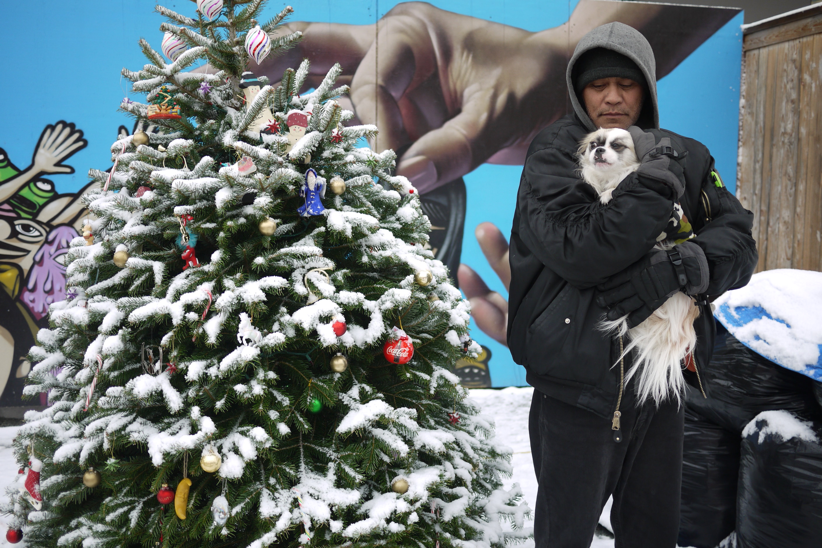caption: Ken Kahaloha, a resident at the South Jackson Street camp is also its kitchen manager. The Jackson Street camp was one of three to replace Nickelsville, which was closed in September.