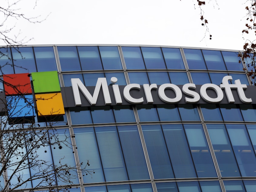 caption: The Microsoft logo is pictured outside the headquarters in Paris, Jan. 8, 2021. A group of video game testers is forming Microsoft's first labor union in the U.S. and the largest in the video game industry. Communications Workers of America said Tuesday, Jan. 3, 2023, that about 300 quality assurance workers at Microsoft video game subsidiary ZeniMax Studios have voted to join the union.