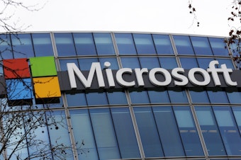caption: The Microsoft logo is pictured outside the headquarters in Paris, Jan. 8, 2021. A group of video game testers is forming Microsoft's first labor union in the U.S. and the largest in the video game industry. Communications Workers of America said Tuesday, Jan. 3, 2023, that about 300 quality assurance workers at Microsoft video game subsidiary ZeniMax Studios have voted to join the union.