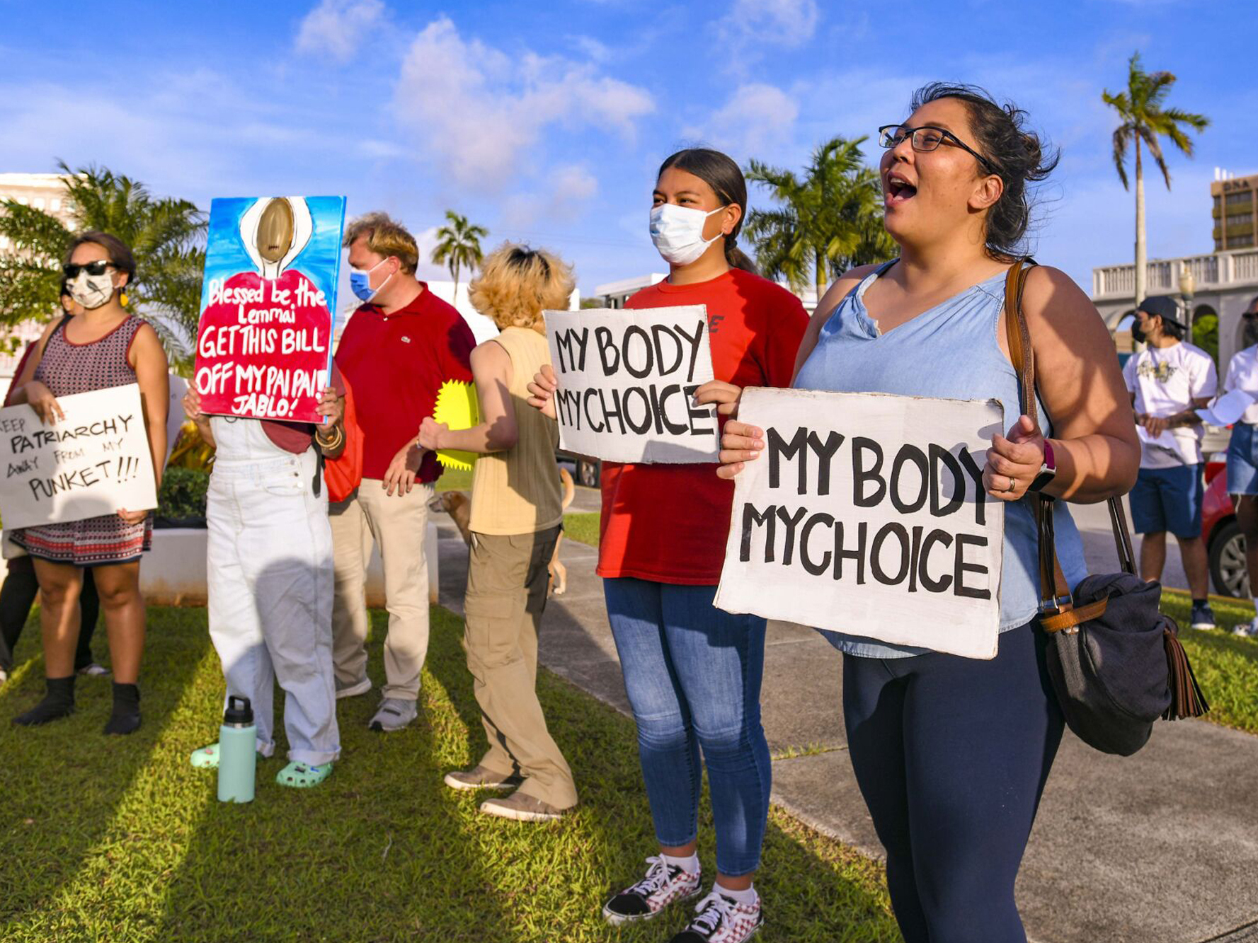 caption: "My body, my choice!" resonates from protesters on the front lawn of the Guam Congress Building in Hagåtña during a protest as they voiced their concerns against the Guam Heartbeat Act of 2022 on April 27, 2022.