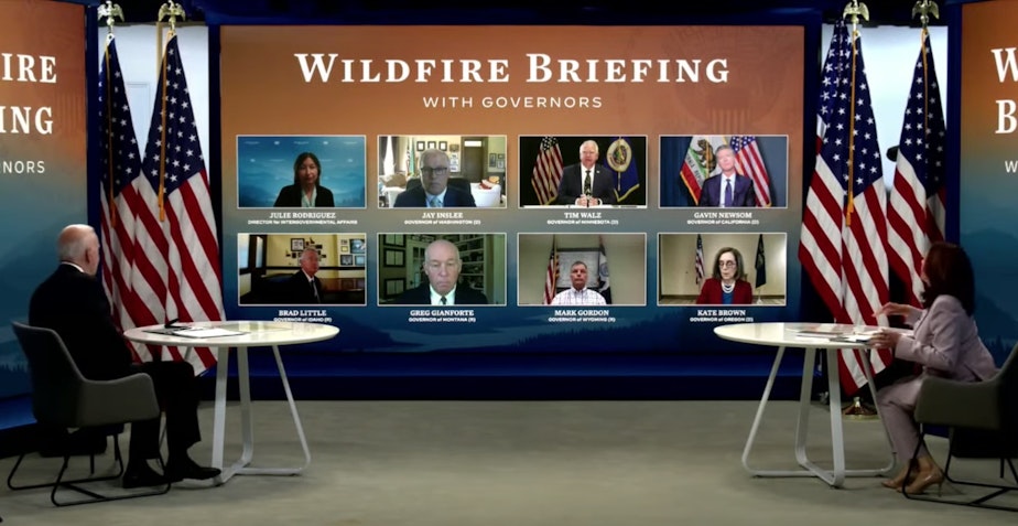 caption:  President Joe Biden and Vice President Kamala Harris attend a virtual wildfire briefing with seven governors.