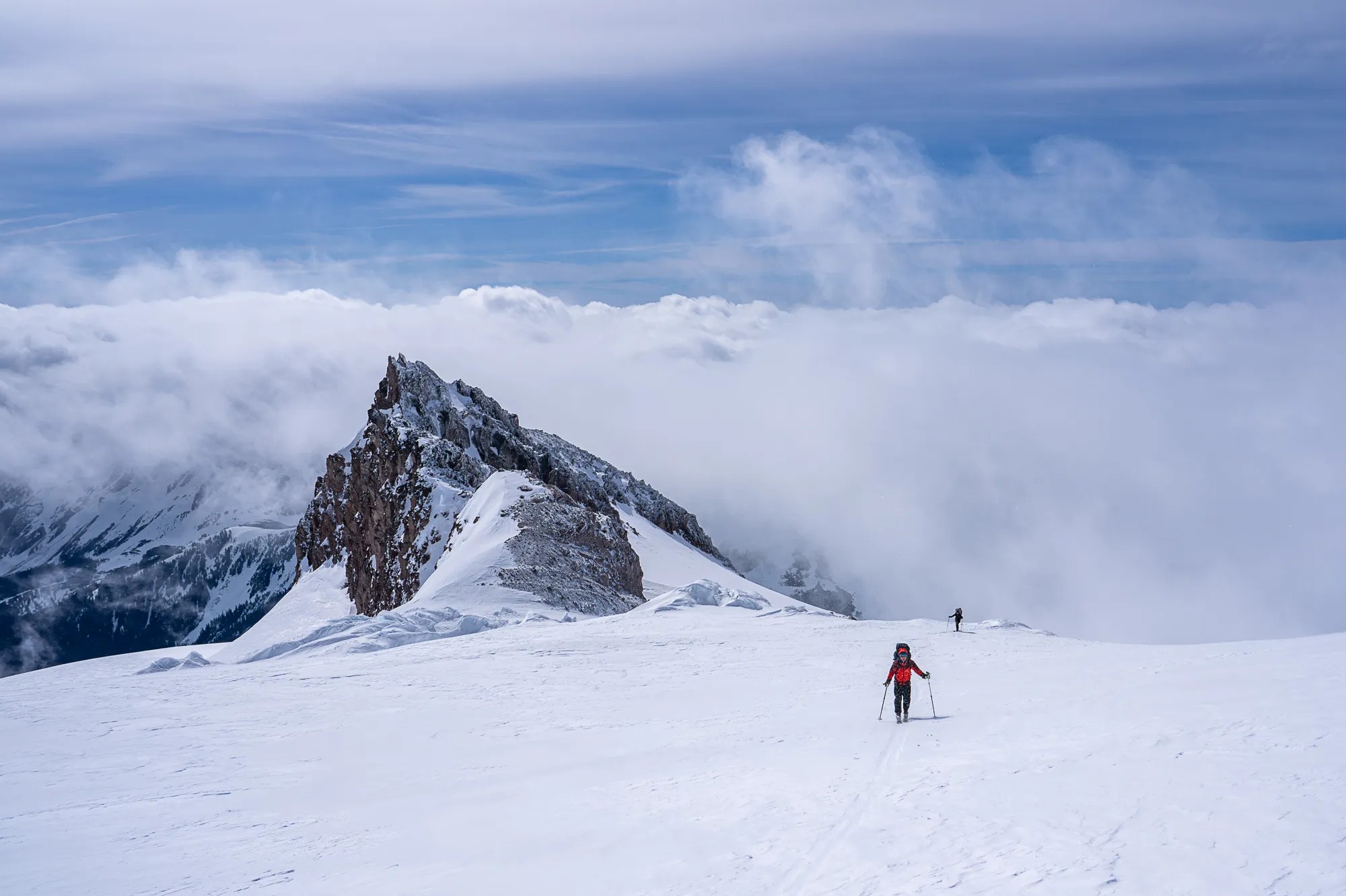 caption: Mountaineers ascend Cool Glacier, named for early 20th-century glacier photographer Adelbert Cool, on Washington’s Glacier Peak on May 24, 2024.