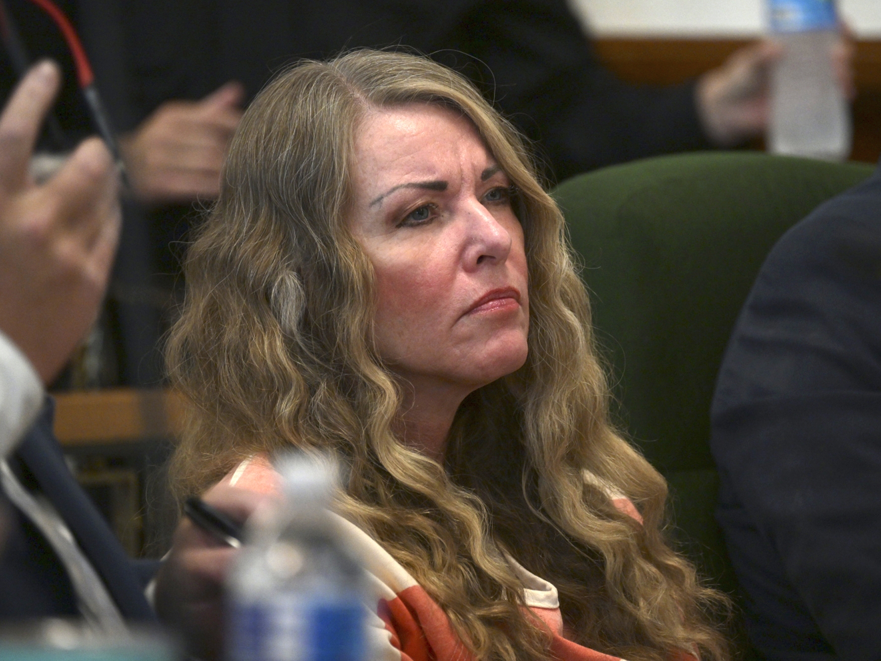 caption: Lori Vallow Daybell, seen here in 2023, is representing herself in a courtroom in Phoenix, where she is on trial on a charge of conspiracy to commit first degree murder.