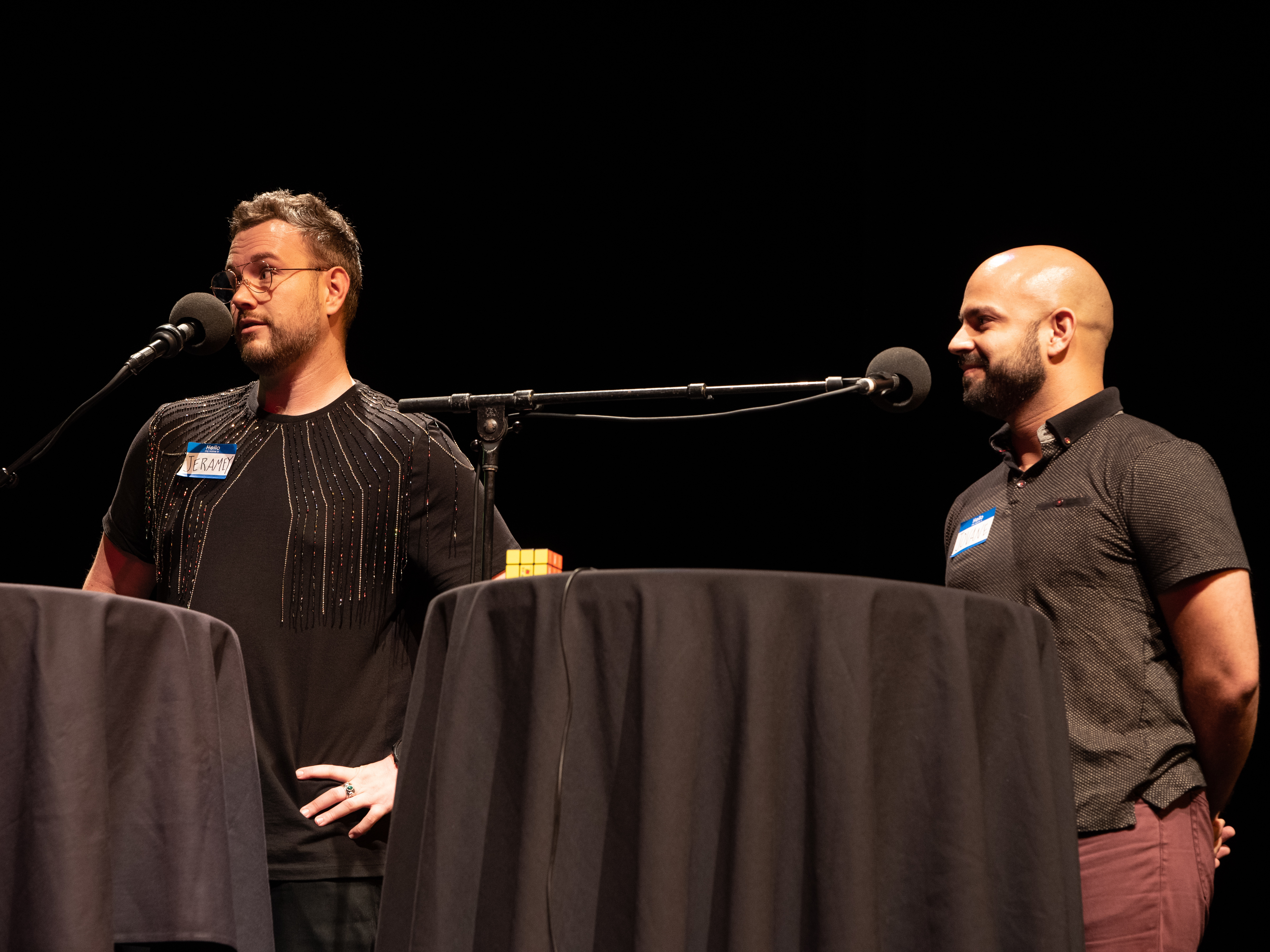 caption: Contestants Jeramey and Jovane go head-to-head in <em>Ask Me Another'</em>s final round at the Majestic Theatre in Dallas, Texas.