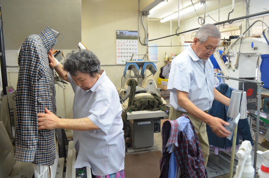 caption: Hyen Sook Kang and Tae Park work in their Wallingford business, Sun Dry Cleaners. They've switched to a wet cleaning process to avoid toxic dry cleaning chemicals.