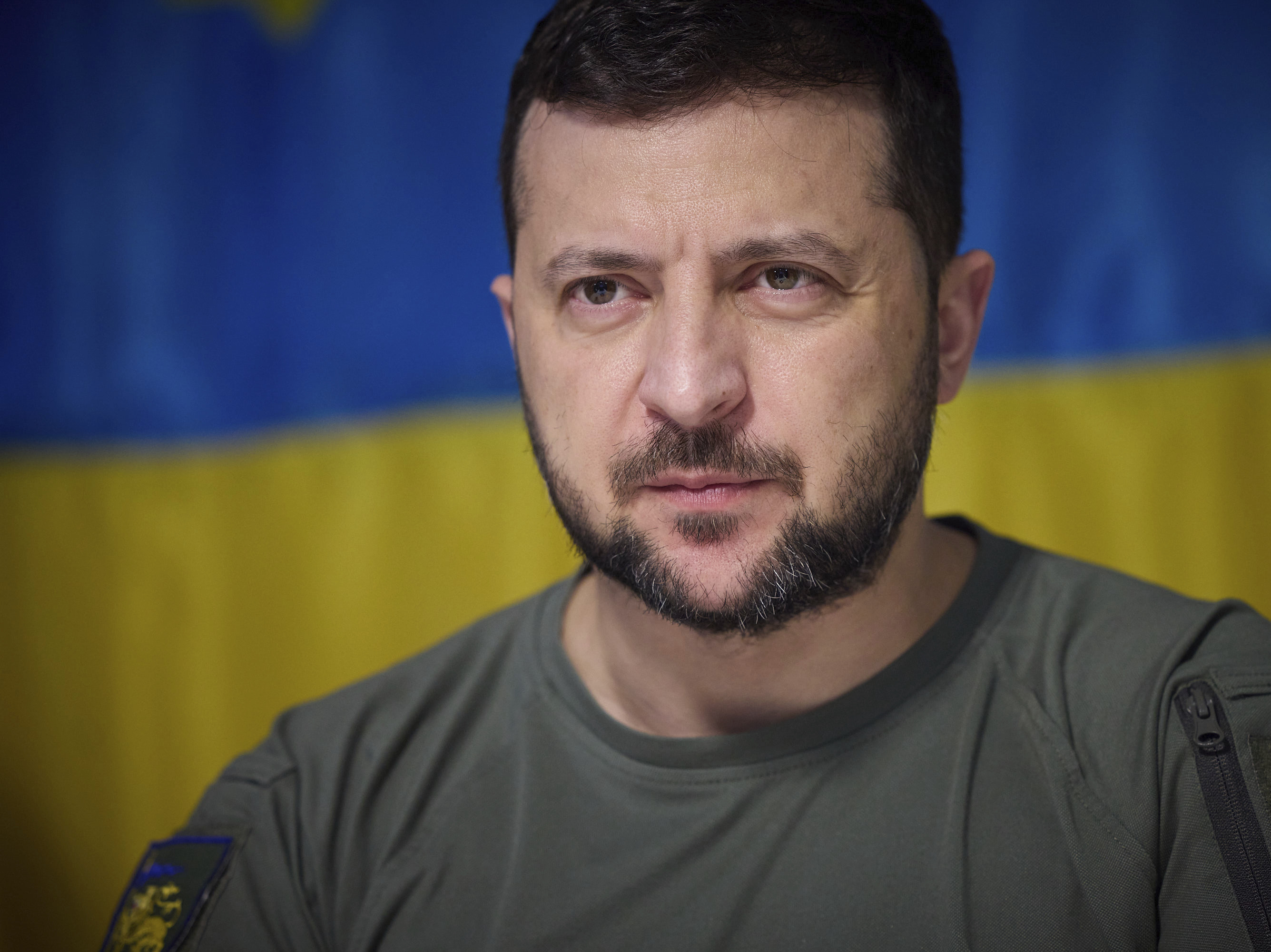 caption: In this photo provided by the Ukrainian Presidential Press Office on July 8, 2022, Ukrainian President Volodymyr Zelenskyy, attends a meeting with military officials during his visit the war-hit Dnipropetrovsk region.