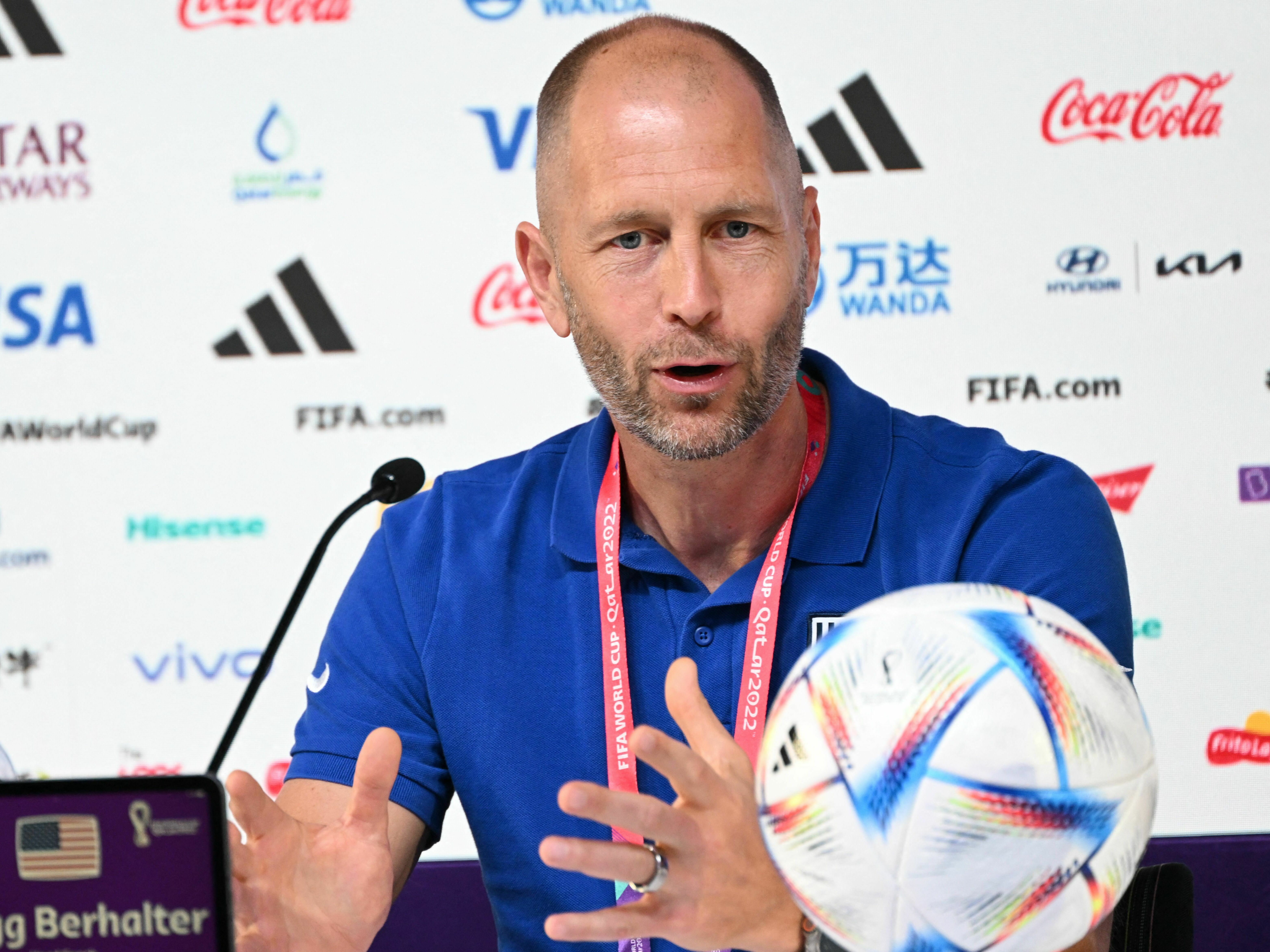 caption: USA coach Gregg Berhalter speaks during a press conference at the Qatar National Convention Center in Doha on December 2, 2022, on the eve of the USA's World Cup soccer match against the Netherlands.