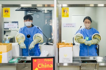 caption: It's COVID testing time at Incheon International Airport, west of Seoul, South Korea. Arrivals from China must now submit to a PCR test.